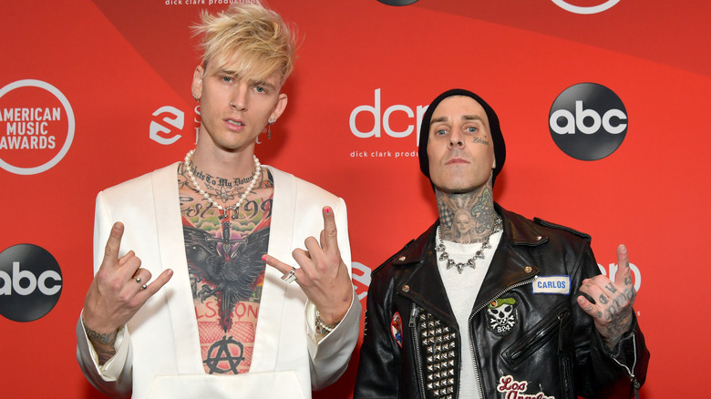 Machine Gun Kelly posing with Travis Barker