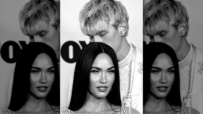 MGK standing behind Megan Fox