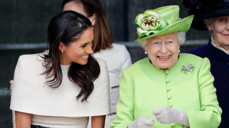 Queen Elizabeth II with Meghan Markle smiling