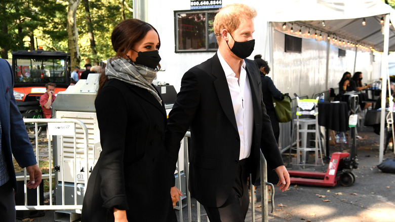 Meghan Markle, Prince Harry wearing masks