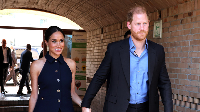 prince harry and meghan markle walking hand in hand