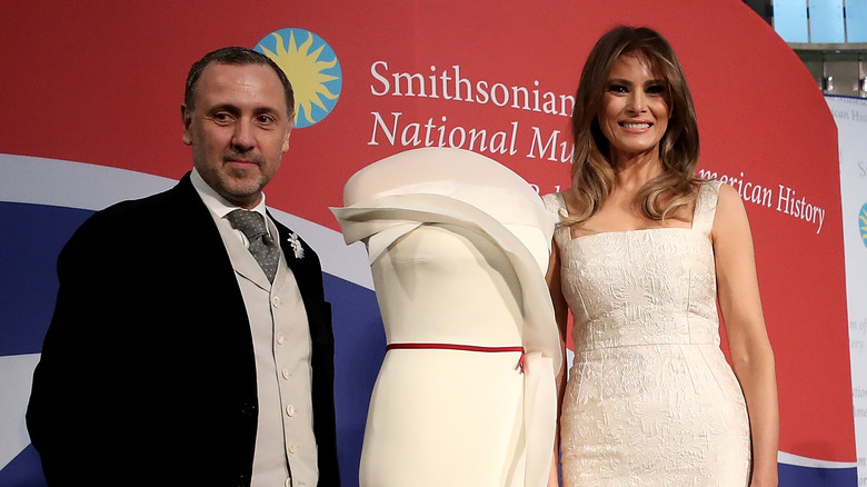 Hervé Pierre and Melania Trump posing with dress