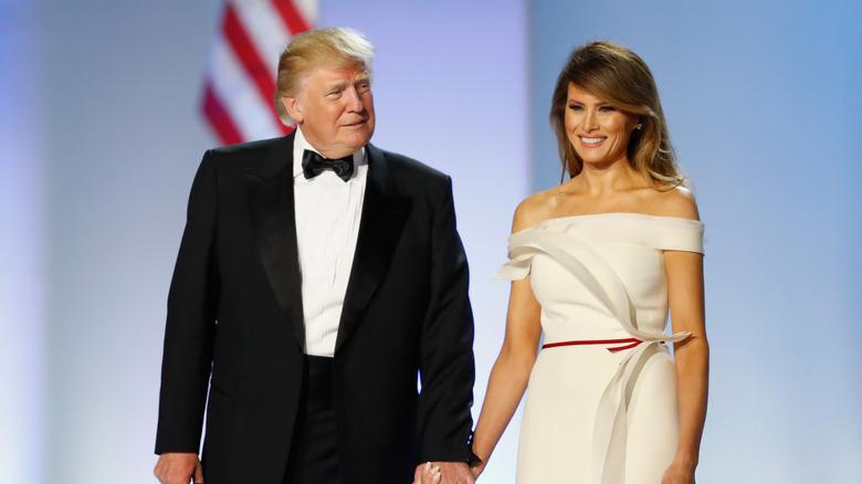 Donald and Melania Trump holding hands
