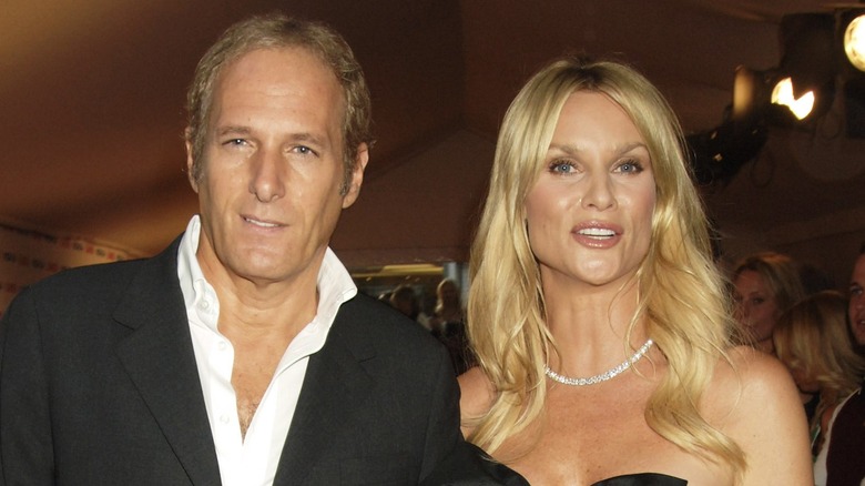 Michael Bolton and Nicolette Sheridan smiling on the red carpet