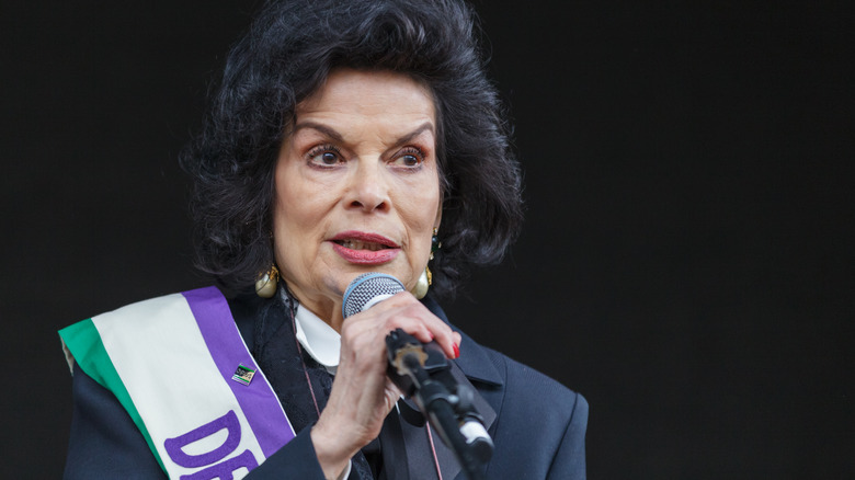 Bianca Jagger speaking into a microphone
