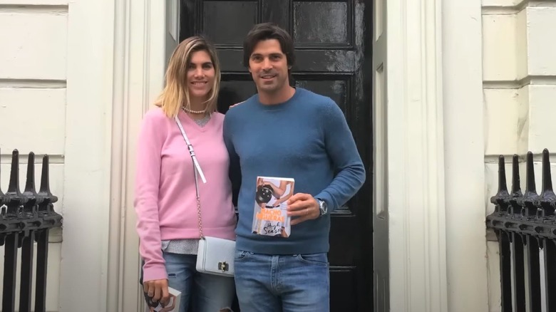 Delfina Blaquier and Nacho Figueras posing with book