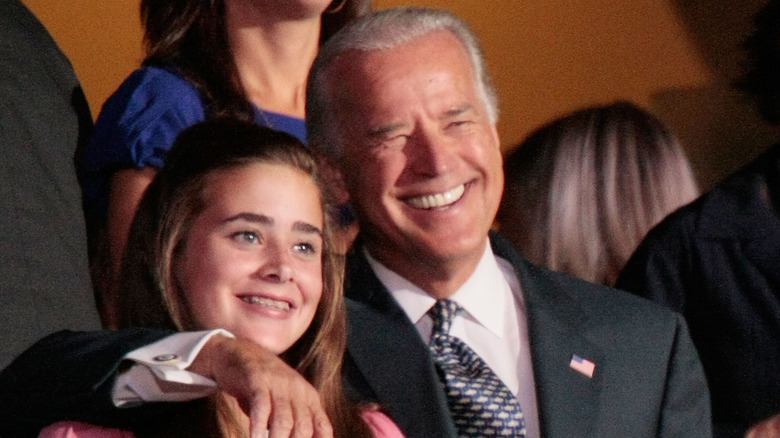 Joe Biden smiling with arm around Natalie