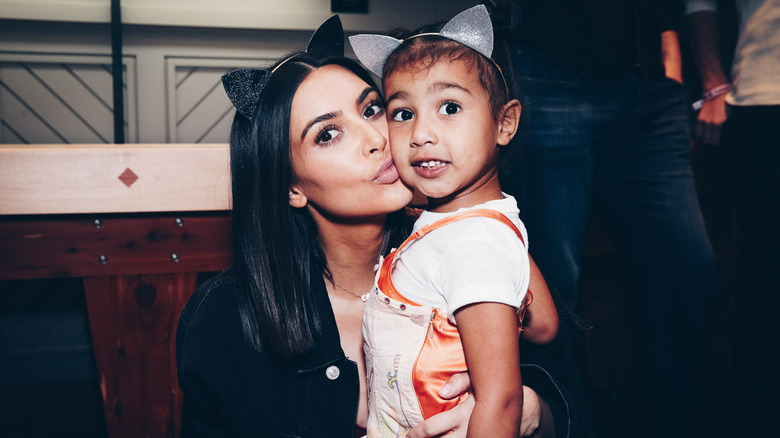 Kim Kardashian kissing North West on cheek