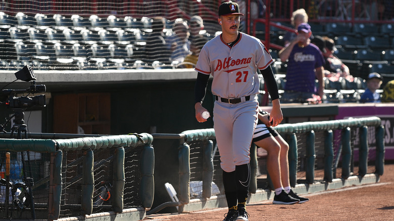 Paul Skenes walking on a baseball field