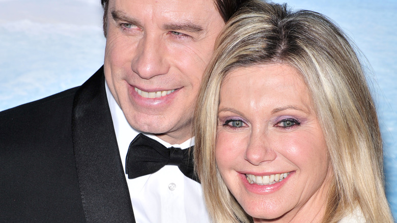 Olivia Newton-John and John Travolta smiling 