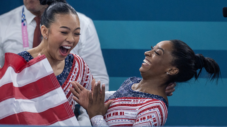 Simone Biles and Suni Lee celebrating