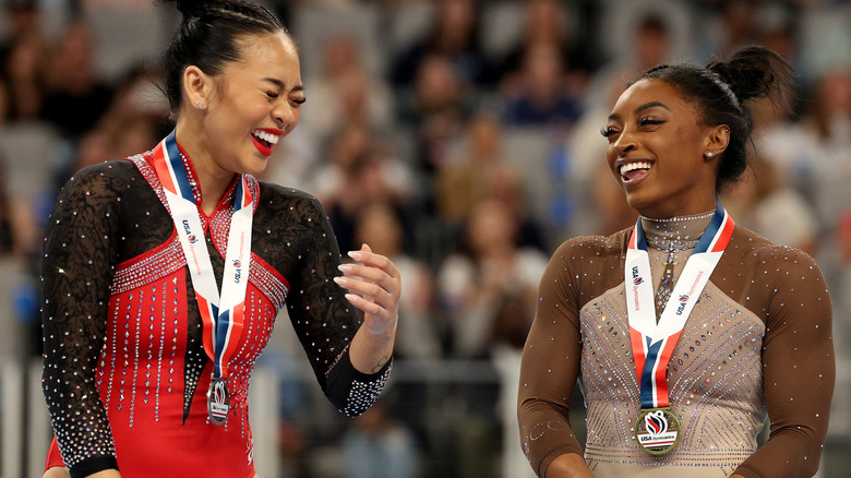 Suni Lee and Simone Biles laughing together