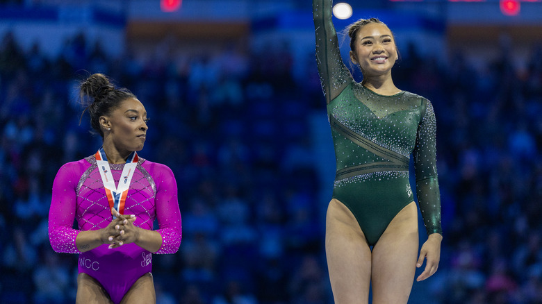 Simone Biles and Suni Lee competing together