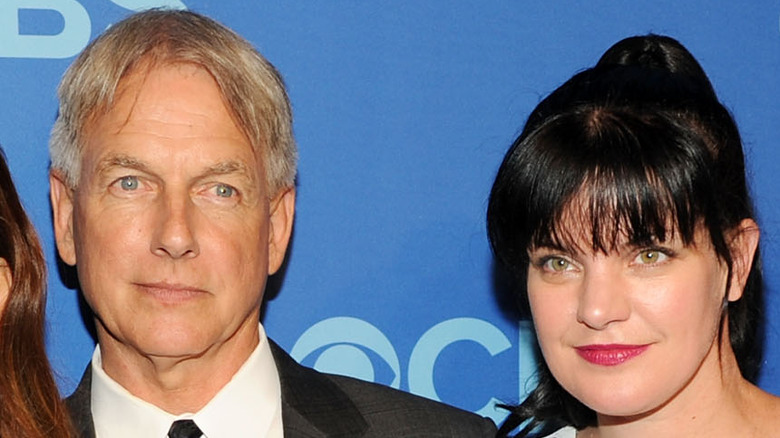 Mark Harmon and Pauley Perrette look at cameras with stares