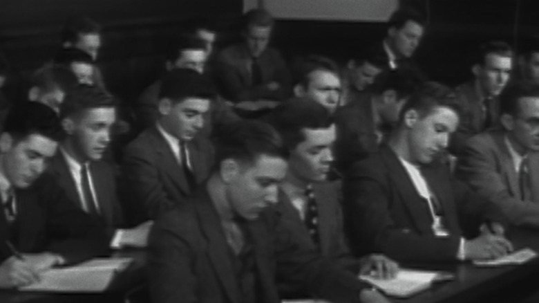 Men wearing suits in classroom