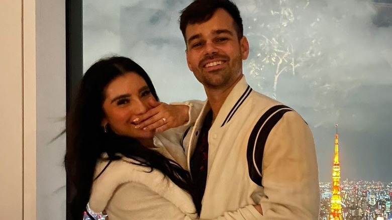 Ben Hausdorff and Kirstin Maldonado wearing wedding attire