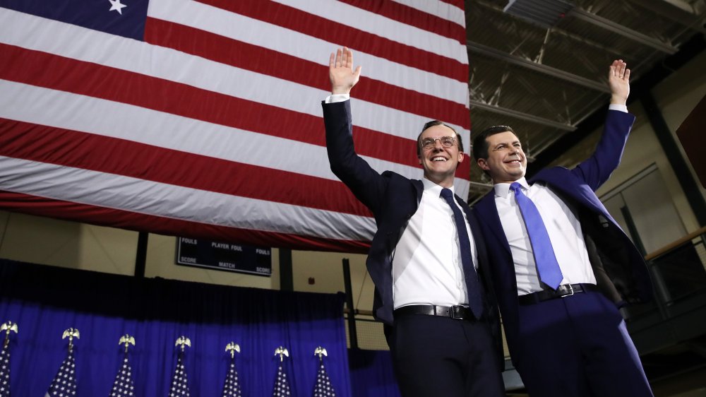 Pete and Chasten Buttigieg waving