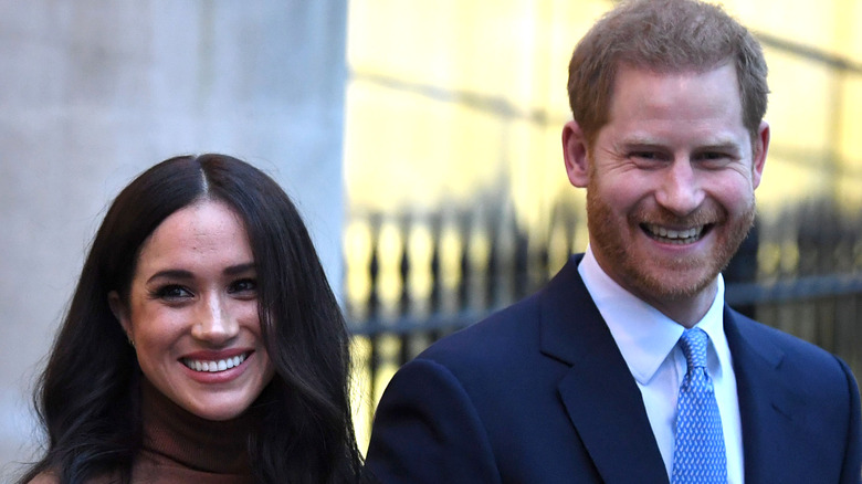 Prince Harry and Meghan Markle smiling