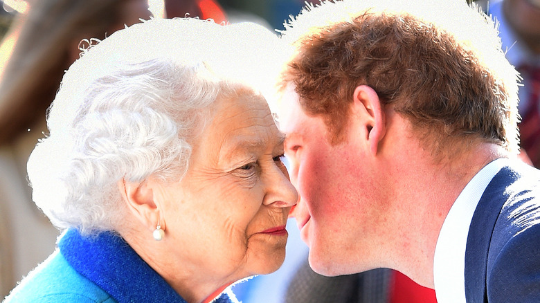 Queen Elizabeth and Prince Harry embracing 