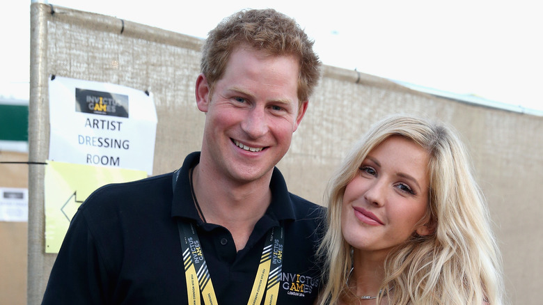 Prince Harry posing with Ellie Goulding