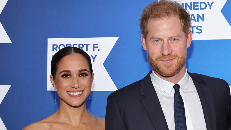 Prince Harry and Meghan Markle smiling