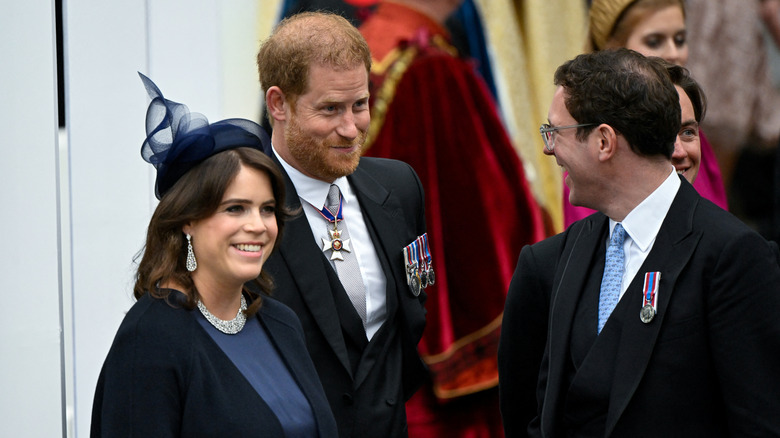 Prince Harry laughing with Princess Eugenie and Jack Brooksbank