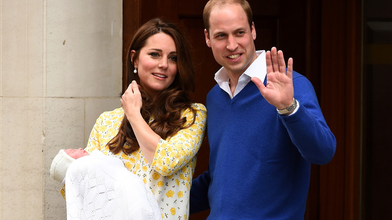 William and Kate holding Princess Charlotte outside hospital