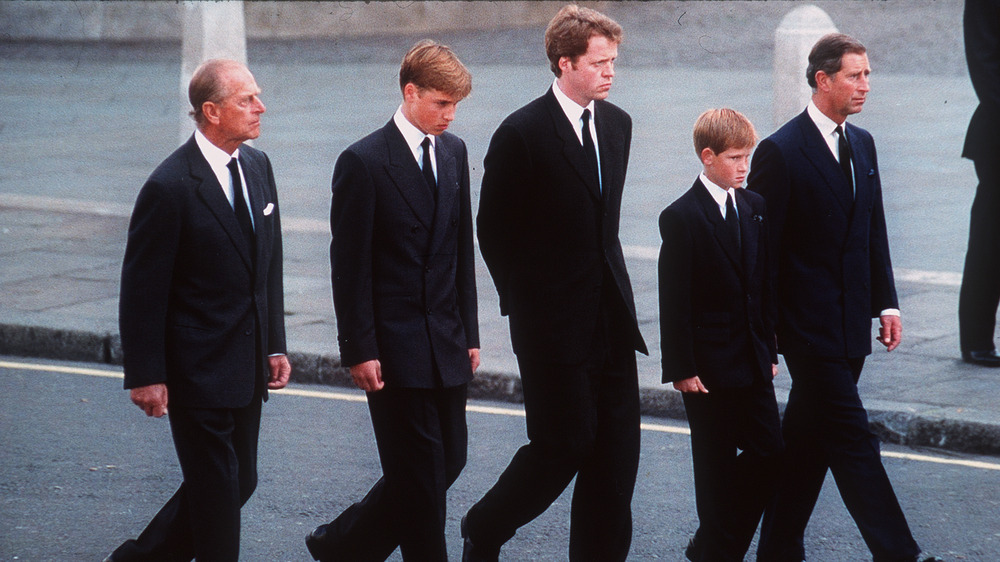 Prince Philip walking next to William in Diana's funeral procession