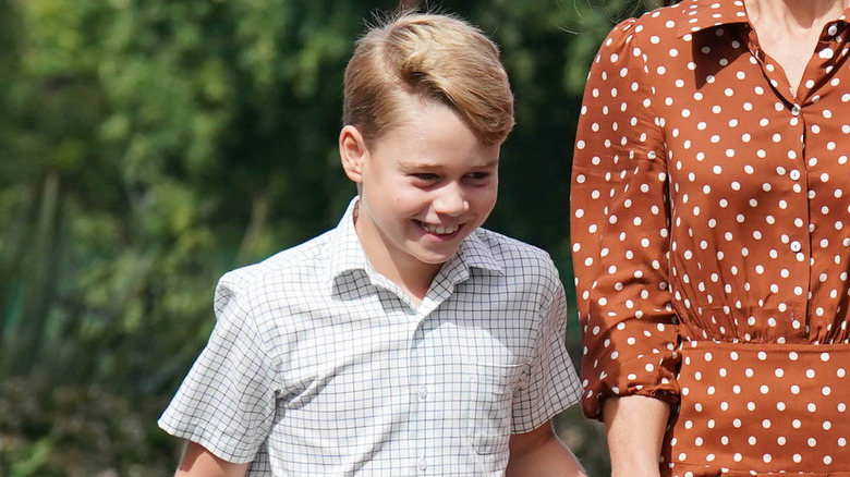 Prince William, Prince George, Princess Catherine, and Princess Charlotte smiling