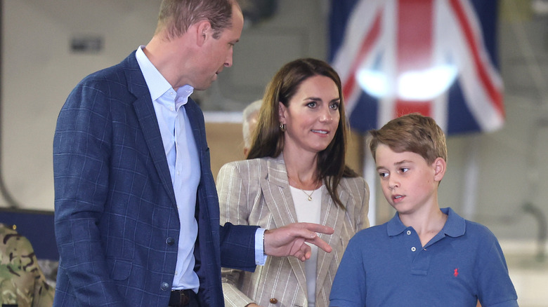 Prince William talking to Prince George