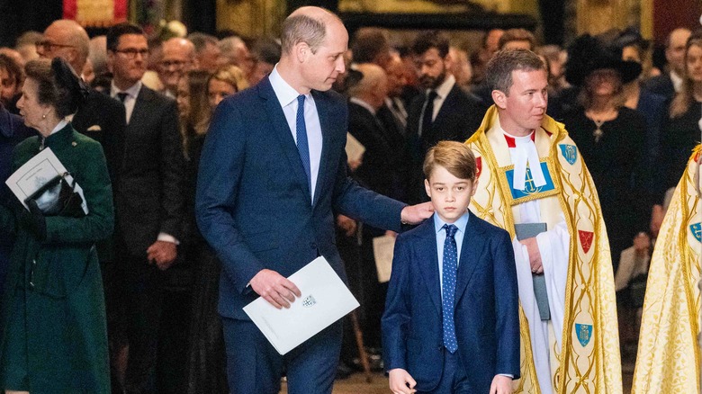 Prince William holding Prince George