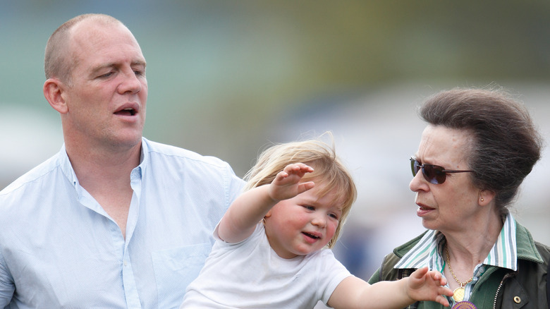 Mike Tindall and Princess Anne looking at Mia