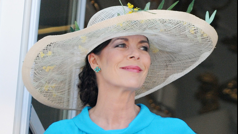 Princess Caroline smiling at Charlene's wedding