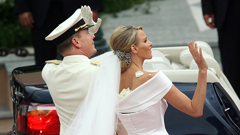 Albert and Charlene waving on wedding day