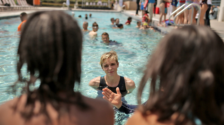 Charlene teaching kids how to swim