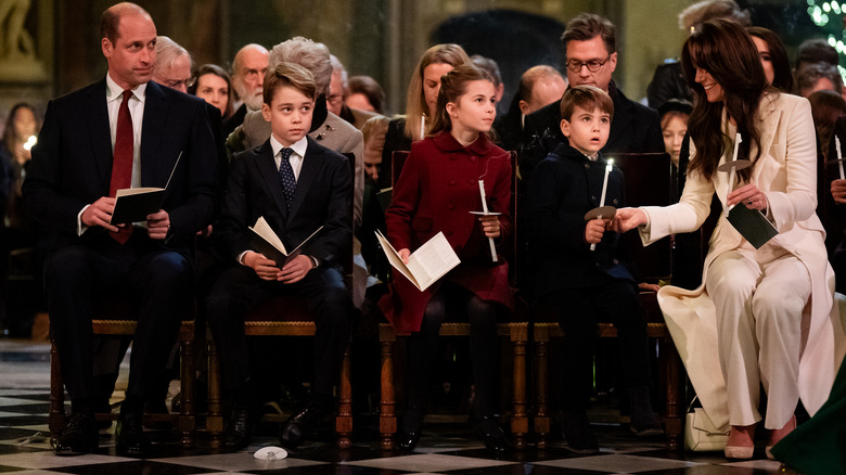 Princess Charlotte seated at church with her brothers