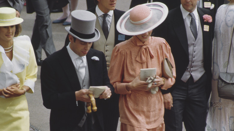 Prince Andrew and Princess Diana wearing hats