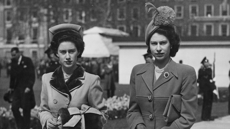 Queen Elizabeth and Princess Margaret walking together