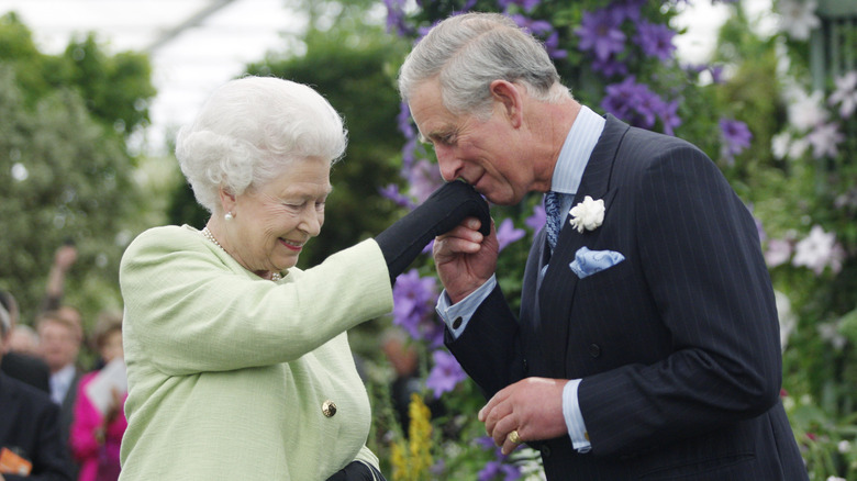 Prince Charles kissing Queen Elizabeth's hand