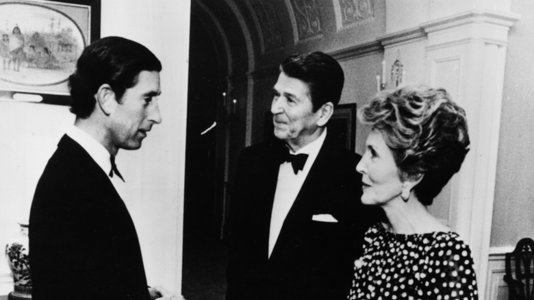 Prince Charles talking to the Reagans