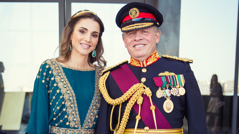 Queen Rania smiles with King Abdullah II 