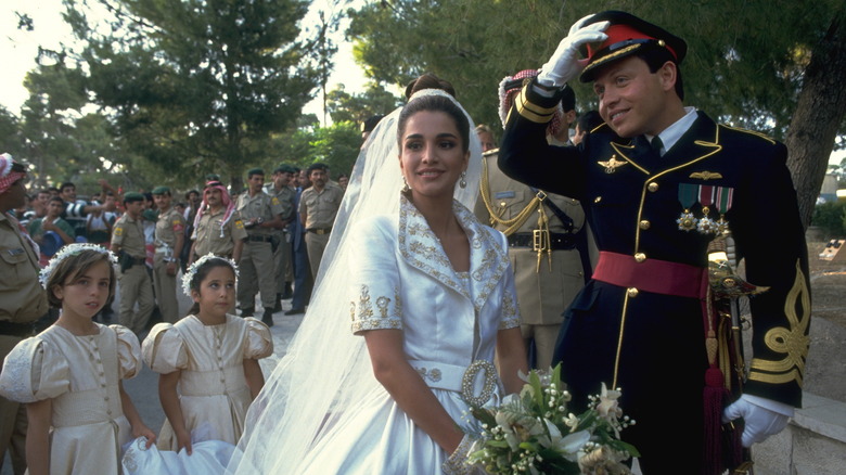 Queen Rania and King Abdullah II smile on wedding day