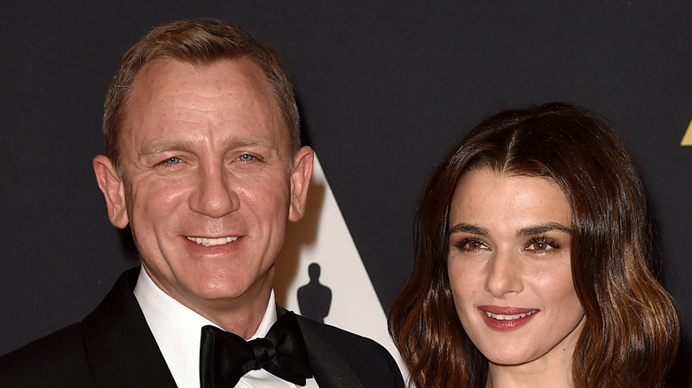 Rachel Weisz and Daniel Craig smile on the red carpet