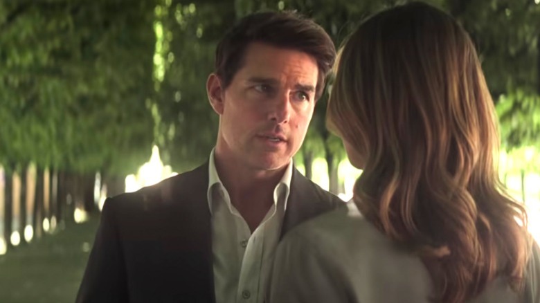 Tom Cruise and Rebecca Ferguson talking