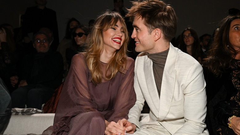Suki Waterhouse laughing with Robert Pattinson