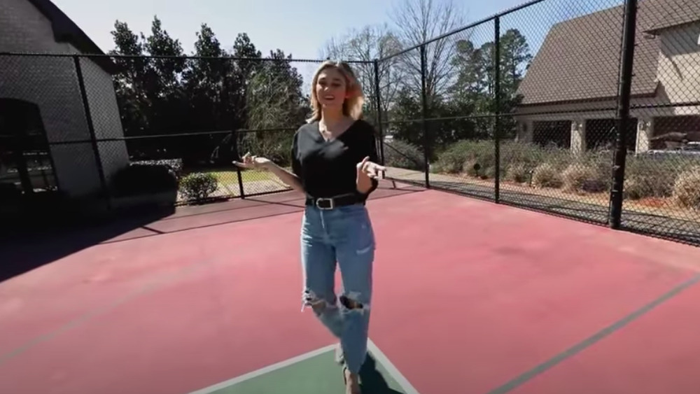 Sadie Robertson on the tennis court outside of her home