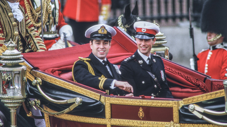 Prince Andrew and Prince Edward ride in a carriage