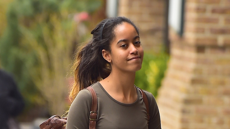 Malia Obama walking and smiling