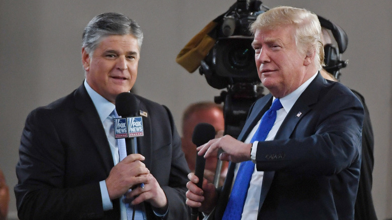 Sean Hannity and Donald Trump at an event 