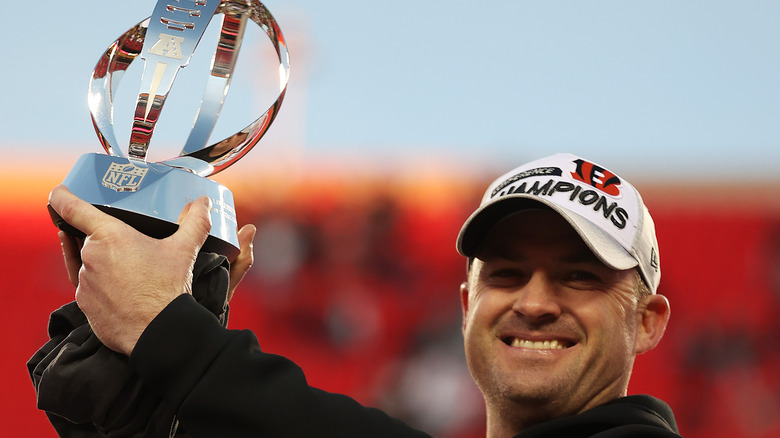 Zac Taylor holding trophy and smiling 